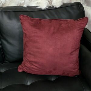 Burgundy velvet throw pillow.