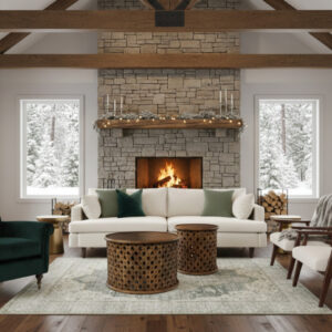 Winter themed lounge setting featuring hunter green armchair, off white velvet couch, rattan coffee tables, white and green patterned rug, and two rattan arm chairs.