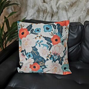 Large floral print throw pillow with teal, orange, and pink floral patterns.