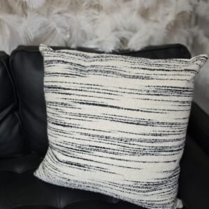White pillow with thin black stripes