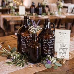 image of sparrow mismatched amber growlers set as wedding centerpieces