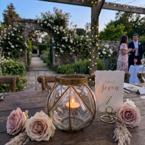 image of ursula tea light votive set on a wedding table with pink roses
