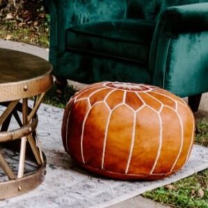 Leather pouf rental with a white stitched pattern styled in a cocktail hour lounge setting.