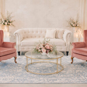 image of pink chairs and a tan loveseat rental on a blue rug