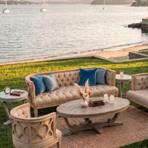 1 sofa neutral sofa, 2 matching neutral chairs, a grey wood coffee table, and two matching end tables